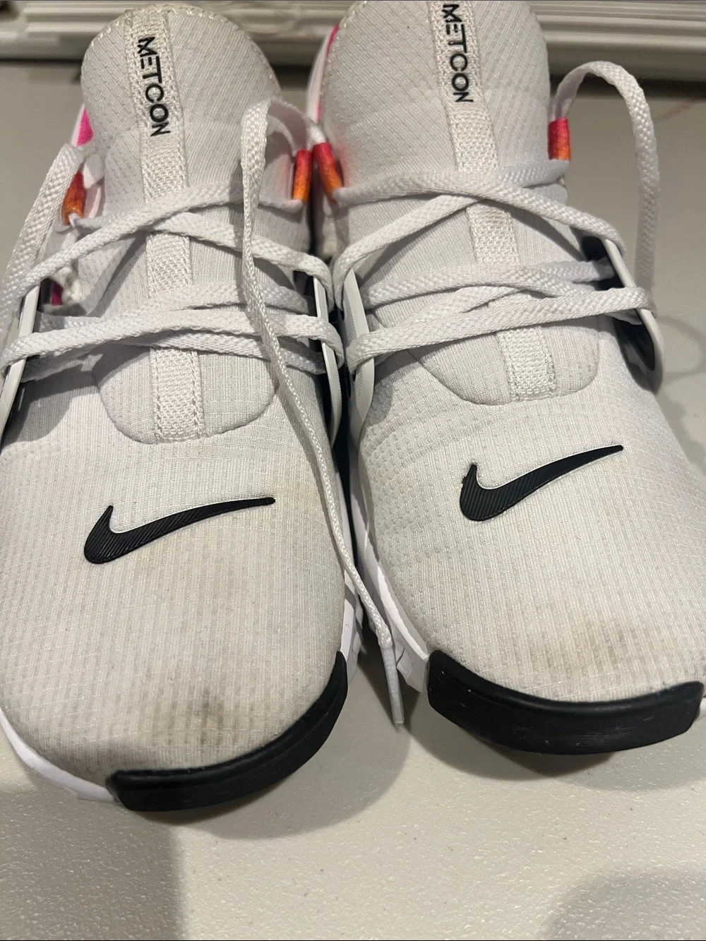 Nike White Metcon Training Shoes with Black Swoosh and Pink/Orange Pull Tabs